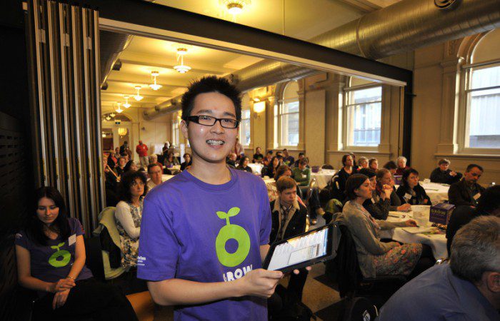 Volunteer Joshua Teng monitors Twitter at the Melbourne launch of Oxfam's GROW campaign. Photo: Lara McKinley/OxfamAUS