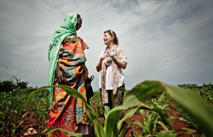 Natasha Stott Despoja with Awa in one of her fields. Photo: Pablo Tosco/Oxfam