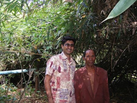 Manish with the farmer they visited at Song Khon. Photo: OxfamAUS