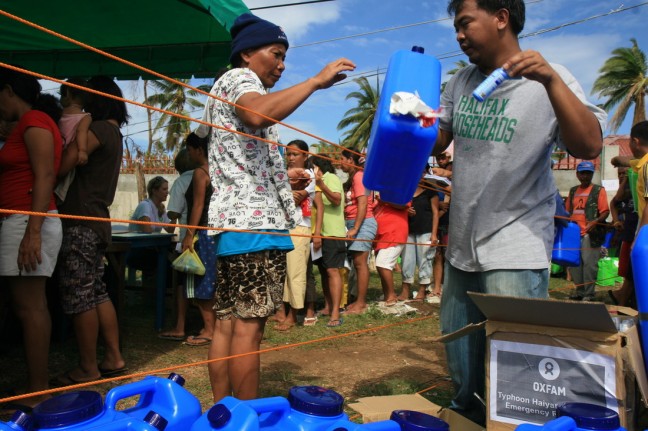 Oxfam hygiene and water purification kits were given to families in the coastal region of Daanbantayan over two days. Photo: Jane Beesley/Oxfam