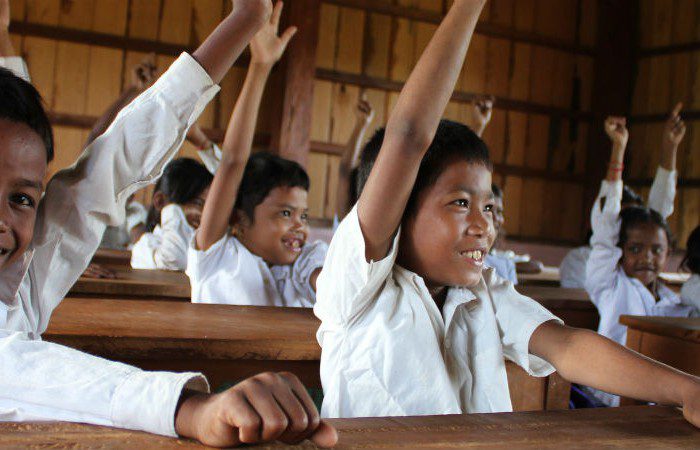 School kids in Tial village raise their hands for Sustainable Development Goals