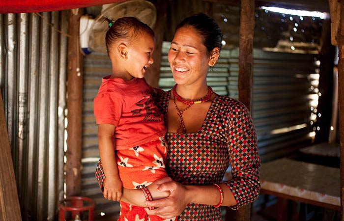 Tirsana Achaya pictured at her home in Sindhupalchok with her son Aman, where Oxfam installed water and sanitation facilities as part of the Earthquake response