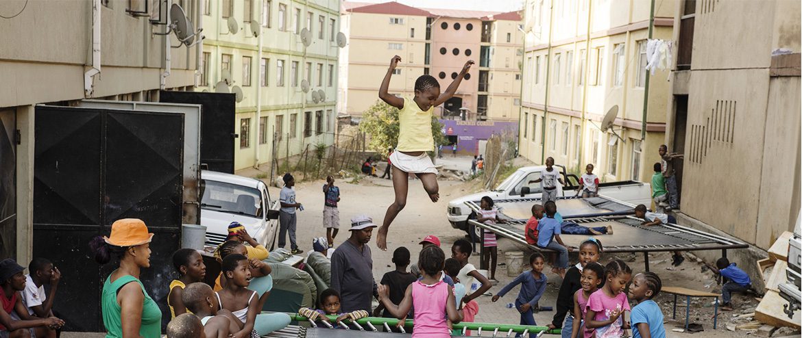 children jumping on a trampoline in South Africa.
