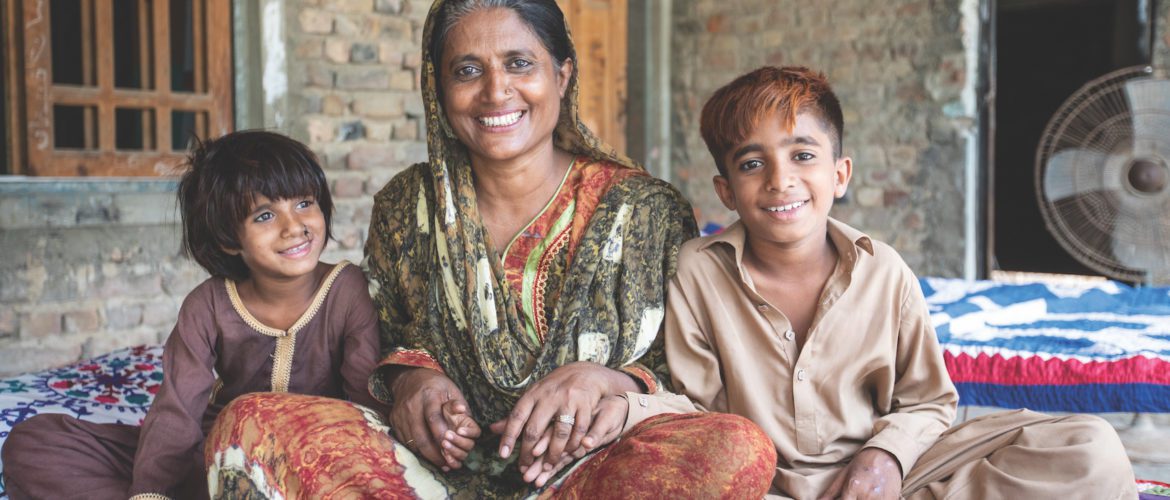 Shafi Mohammad Solangi, Hyderabad (Pakistan): Sara Solangi (42) pictured with her two sons Ayan* and Yasir*, is a Community group member and beneficiary of Women’s Leadership training who has campaigned for the last three years for her village to be granted fair and equal access to water.